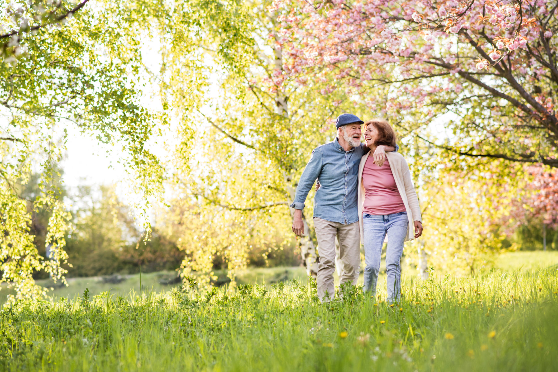 Beautiful senior couple in love outside in spring nature.